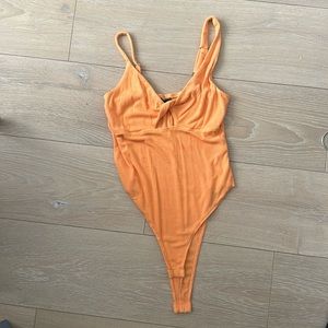 Orange Asymmetric Bodysuit